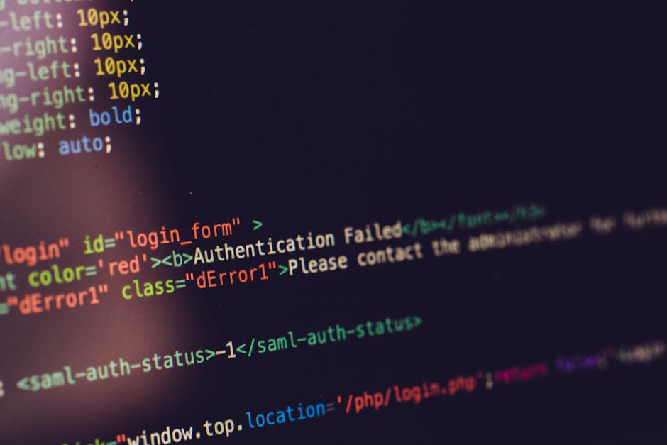 A close-up digital screen displaying lines of HTML code in various colors such as pink, yellow, and green. The code includes elements like links, classes, and tags related to website layout and featur